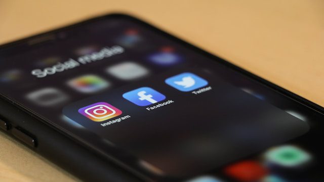 A phone screen with social media icons.